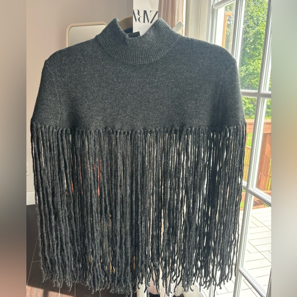 Fringed cape